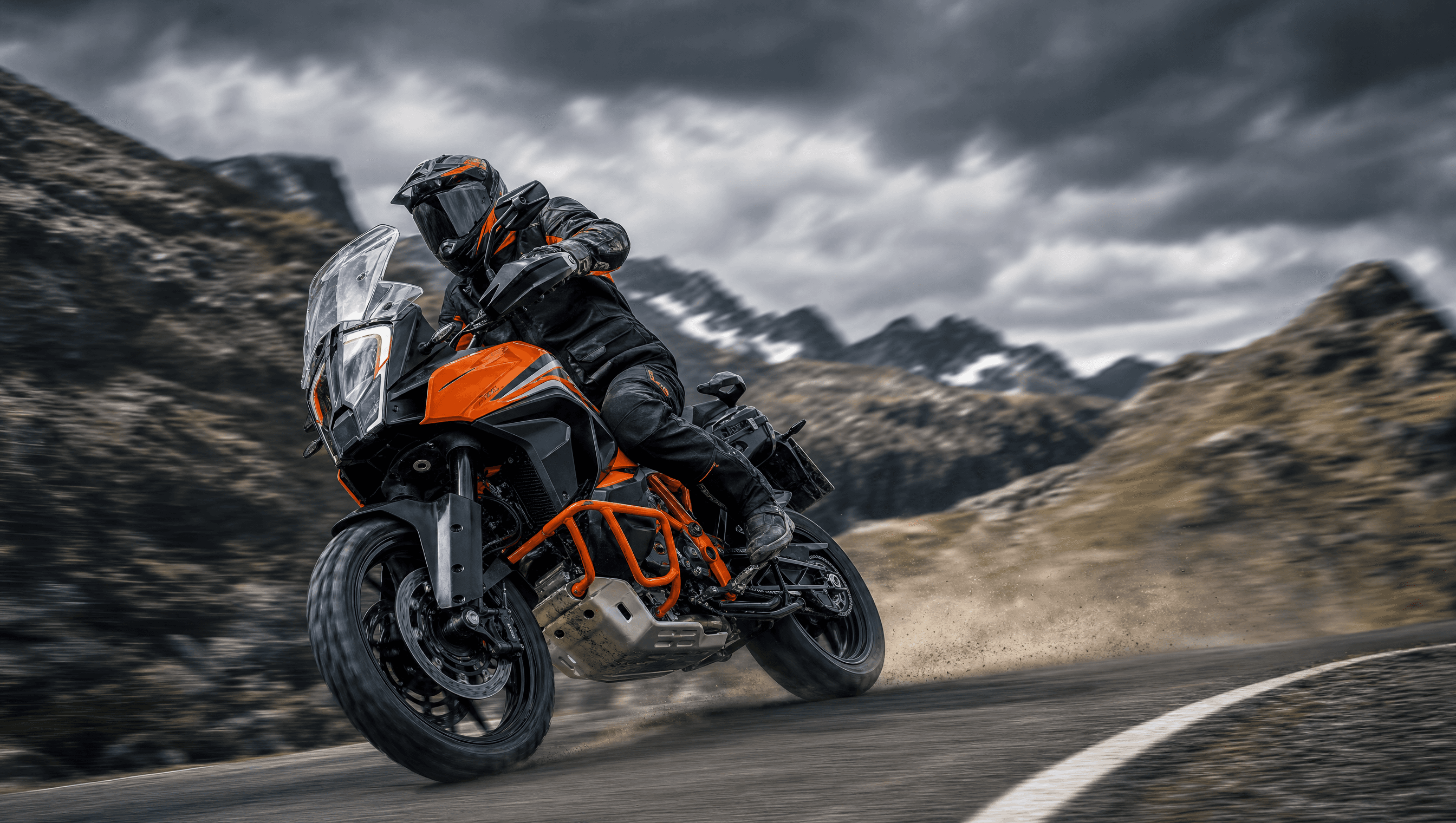 Orange KTM 1290 Super Adventure leaned over on a mountain road — KTM cash buyer Melbourne